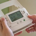 Holding a Thermostat