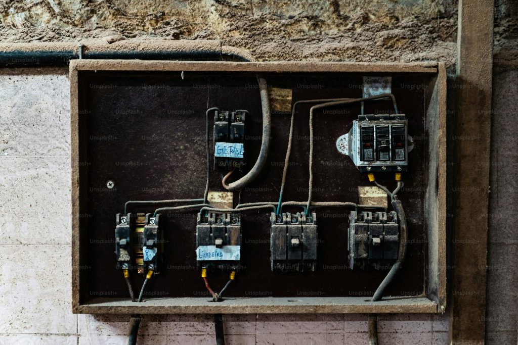a box with multiple electrical wires and wires attached to it
